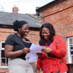 Student and her mother looking at exam results