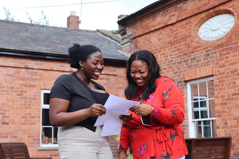 Student and her mother looking at exam results