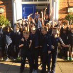 students cheering after winning a medal