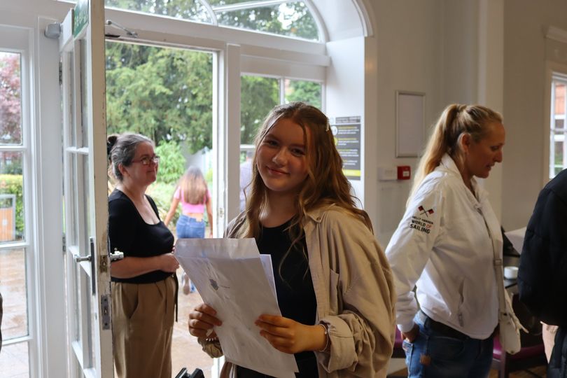Smiling student with their results