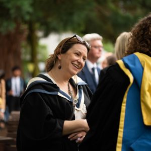 Lady speaking to a student