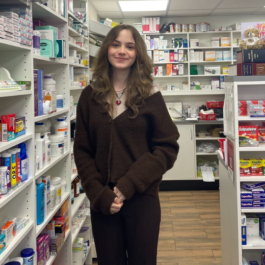 a girl working in a pharmacy