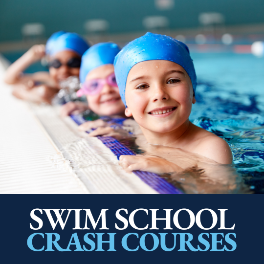 group of children in the swimming pool smiling