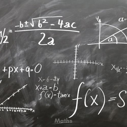 Maths equations written on a blackboard